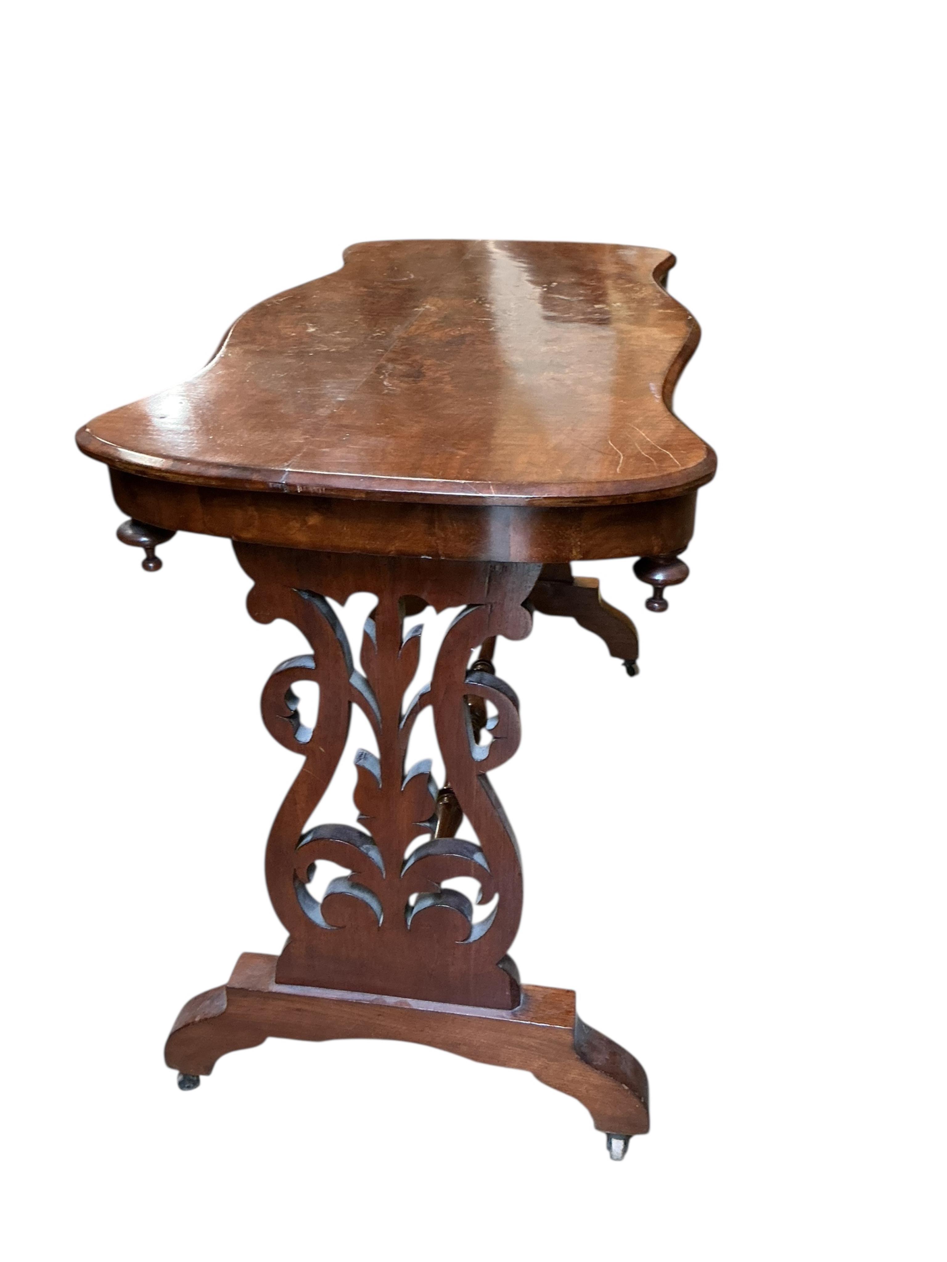 A Victorian walnut serpentine centre table, width 104cm, depth 51cm, height 73cm